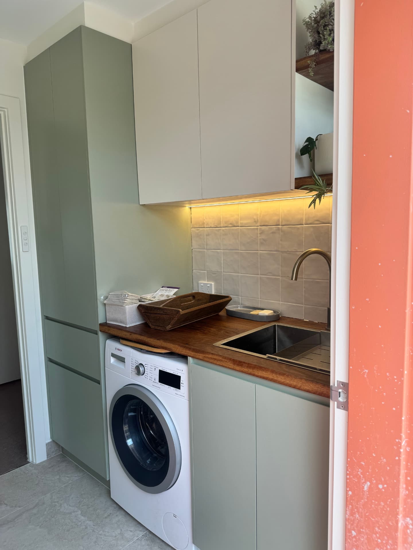 Laundry fit-out with under-cabinet LED lighting and power points installed by MTK Electrics & Air in Canberra