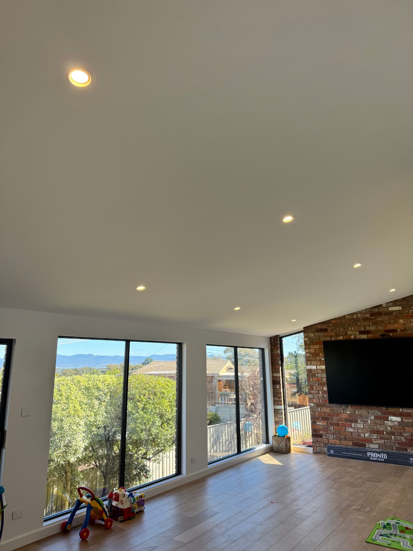 Open-plan Belconnen living room with LED downlights installed by MTK Electrics & Air