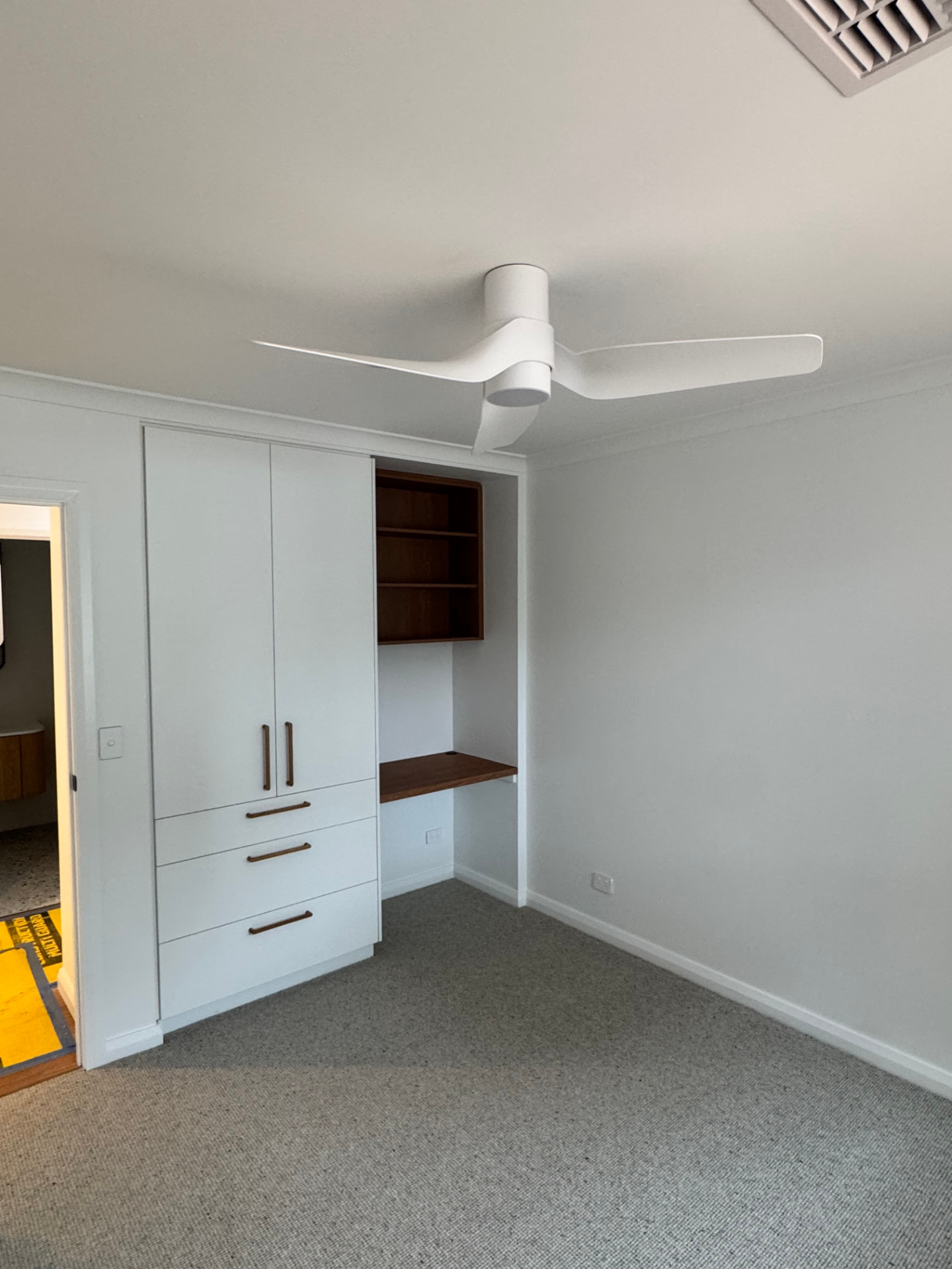 Bedroom with a modern ceiling fan, downlight and power points installed by MTK Electrics & Air in Canberra