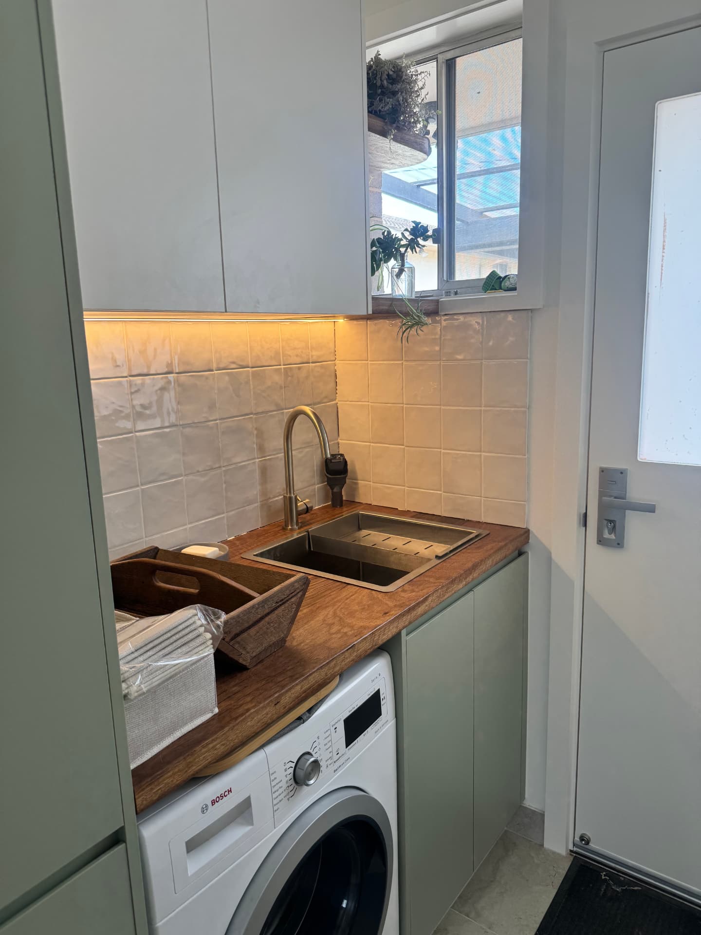 Belconnen laundry with under-cabinet LED lighting and power points installed by MTK Electrics & Air
